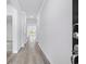 Bright hallway with wood-look flooring and white trim at 2700 Tranquility Loop, Longs, SC 29568