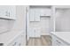 Bright kitchen with white cabinets, stainless steel appliances, and a tile backsplash at 2700 Tranquility Loop, Longs, SC 29568
