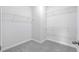 Spacious walk-in closet with wire shelving and neutral carpeting at 2700 Tranquility Loop, Longs, SC 29568