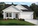 Beautiful single-Gathering home with gray siding, white trim, and manicured lawn at 2708 Tranquility Loop, Longs, SC 29568