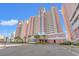 This exterior shows a stunning high-rise condo complex with beautiful landscaping at 2801 S Ocean Blvd. # 941, North Myrtle Beach, SC 29582