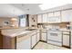 Bright kitchen with white appliances, countertops, and cabinetry for a clean look at 2801 S Ocean Blvd. # 941, North Myrtle Beach, SC 29582
