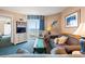 Cozy living room with a sofa, balcony, and a TV for entertainment, ready for relaxation at 2801 S Ocean Blvd. # 941, North Myrtle Beach, SC 29582