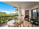 Inviting balcony with wicker furniture and stunning city views, perfect for relaxing and entertaining at 310 73Rd Ave. N # 5B, Myrtle Beach, SC 29572