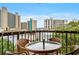 Enjoy the view from this cozy balcony, featuring a table and chairs for relaxing outdoors at 310 73Rd Ave. N # 5B, Myrtle Beach, SC 29572