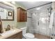 Modern bathroom featuring a glass-enclosed shower, updated fixtures, and a vanity with ample storage at 310 73Rd Ave. N # 5B, Myrtle Beach, SC 29572
