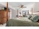 Relaxing bedroom with a four poster bed, wooden furniture, and access to a private balcony at 310 73Rd Ave. N # 5B, Myrtle Beach, SC 29572