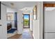 Bright hallway leading to bedroom and balcony, showcasing the home's layout and access to outdoor space at 310 73Rd Ave. N # 5B, Myrtle Beach, SC 29572