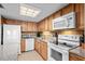 Updated kitchen with ample cabinets, granite counters, and modern appliances for easy cooking at 310 73Rd Ave. N # 5B, Myrtle Beach, SC 29572