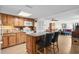 Charming kitchen with wood cabinets, island seating, and open layout to the dining area at 310 73Rd Ave. N # 5B, Myrtle Beach, SC 29572
