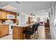 Open concept with kitchen island featuring bar seating, modern appliances, and connecting living space at 310 73Rd Ave. N # 5B, Myrtle Beach, SC 29572