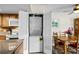 Convenient laundry closet with stacked washer and dryer located off the kitchen at 310 73Rd Ave. N # 5B, Myrtle Beach, SC 29572