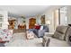 Inviting living room featuring a comfortable sofa, patterned chairs and ottoman, and recliner at 310 73Rd Ave. N # 5B, Myrtle Beach, SC 29572