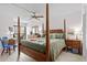 The primary bedroom has a private balcony, lots of natural light, and a ceiling fan at 310 73Rd Ave. N # 5B, Myrtle Beach, SC 29572