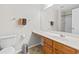 Bathroom featuring oak vanity and countertop space with view of shower and toilet at 314 Kiskadee Loop # 8-C, Conway, SC 29526