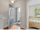 Bright entryway with hardwood floors and a glimpse of a bedroom to the right at 314 Kiskadee Loop # 8-C, Conway, SC 29526
