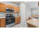 Modern kitchen with stainless steel appliances, ample cabinet space, and updated flooring at 314 Kiskadee Loop # 8-C, Conway, SC 29526