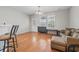 Cozy living room featuring hardwood floors, a comfortable sofa, and natural light at 314 Kiskadee Loop # 8-C, Conway, SC 29526