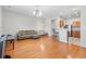 Open concept living room with hardwood floors and a kitchen bar area at 314 Kiskadee Loop # 8-C, Conway, SC 29526