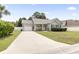 Charming one-story home with manicured front yard, flowers, and a welcoming driveway at 3468 Trailside Dr., Little River, SC 29566
