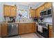 View of the kitchen featuring stainless steel appliances and a window bringing in natural light at 3468 Trailside Dr., Little River, SC 29566