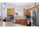 Well-equipped kitchen with stainless steel appliances, light wood cabinets and recessed lighting at 3468 Trailside Dr., Little River, SC 29566