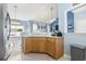 Kitchen with wood cabinets and view to a dining and living room at 3468 Trailside Dr., Little River, SC 29566