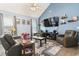 Spacious living room with vaulted ceiling, contemporary furnishings, and ample natural light at 3468 Trailside Dr., Little River, SC 29566
