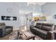 Comfortable living room featuring modern fireplace, recessed lighting, and a view to the foyer and kitchen at 3468 Trailside Dr., Little River, SC 29566