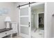 Bathroom with a sliding glass door, neutral walls, and tiled floors at 383 Mikita Dr., Surfside Beach, SC 29575