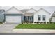 Charming single-Gathering home featuring a two-car garage, lovely landscaping, and a welcoming front porch at 383 Mikita Dr., Surfside Beach, SC 29575