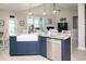 Island kitchen featuring a farmhouse sink, stainless dishwasher, and granite countertops that open to living room at 383 Mikita Dr., Surfside Beach, SC 29575