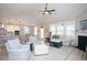 Bright and airy living room featuring a fireplace, comfortable seating, and seamless access to the kitchen at 383 Mikita Dr., Surfside Beach, SC 29575