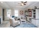 Cozy living room with tray ceilings, comfortable seating, custom built-in cabinetry, and stylish decor at 383 Mikita Dr., Surfside Beach, SC 29575