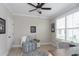 Inviting office area furnished with a comfortable chair, a ceiling fan, and a bright window at 383 Mikita Dr., Surfside Beach, SC 29575