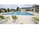 Community pool area featuring inviting lounge chairs and a pristine swimming pool at 383 Mikita Dr., Surfside Beach, SC 29575