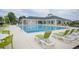 Upscale community pool with ample lounge chairs and inviting clear water at 383 Mikita Dr., Surfside Beach, SC 29575