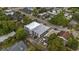 An aerial view shows a two-story building surrounded by greenery and parking areas at 403 14Th Ave. S, Myrtle Beach, SC 29572