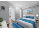 Bright bedroom featuring a comfortable bed, artwork, and doorway to bathroom, creating a relaxing space at 403 14Th Ave. S, Myrtle Beach, SC 29572