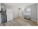 Bright kitchen showcasing updated appliances, laminate floors, and ample natural light at 403 14Th Ave. S, Myrtle Beach, SC 29572