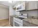 A kitchen featuring stainless steel appliances, granite countertops, and bright lighting at 403 14Th Ave. S, Myrtle Beach, SC 29572