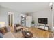 Cozy living room with wood floors, comfortable seating, TV and easy access to an open kitchen at 403 14Th Ave. S, Myrtle Beach, SC 29572
