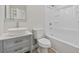 Bathroom with modern vanity, sink, and bathtub shower combo at 409 2Nd Ave. S, Myrtle Beach, SC 29577