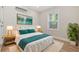 Stylishly decorated bedroom with a large bed, neutral walls, and a bright window at 409 2Nd Ave. S, Myrtle Beach, SC 29577