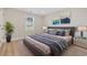 Stylishly decorated bedroom with a large bed, neutral walls, and a bright window at 409 2Nd Ave. S, Myrtle Beach, SC 29577
