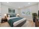 Bedroom with a gray headboard bed and a large window at 409 2Nd Ave. S, Myrtle Beach, SC 29577