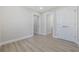 Neutral bedroom with white doors, wood-look flooring, and a spacious walk-in closet at 409 2Nd Ave. S, Myrtle Beach, SC 29577