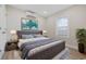 Cozy bedroom featuring a comfortable bed, stylish decor, and a bright window at 409 2Nd Ave. S, Myrtle Beach, SC 29577