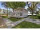 Charming home with a staircase, complemented by lush landscaping and a well-maintained yard at 409 2Nd Ave. S, Myrtle Beach, SC 29577