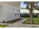 The property's exterior showcasing a well-maintained lawn, walkway, and building detail at 409 2Nd Ave. S, Myrtle Beach, SC 29577